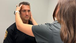 Franklin County, OH, Sheriff's Deputy Josh Walters is examined by certified athletic trainer Kate Brubaker at the Ohio State University Wexner Medical Center. A recent study by researchers at Ohio State finds law enforcement officers who have had one or more head injuries were more likely to experience symptoms of depression and PTSD. Franklin County, OH, Sheriff's Deputy Josh Walters is examined by certified athletic trainer Kate Brubaker at the Ohio State University Wexner Medical Center. A recent study by researchers at Ohio State finds law enforcement officers who have had one or more head injuries were more likely to experience symptoms of depression and PTSD.