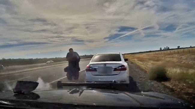 Dashboard camera footage captured a suspect armed with a rifle opening fire and shooting a California Highway Patrol officer before stealing his cruiser in October.