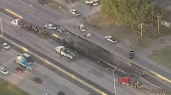 Fort Worth police officer hit by car at scene of I-35W fuel spill