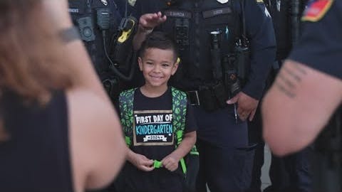 Dallas Police comes together to escort a fallen officer's son to his first day of school