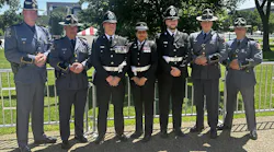 Officers from the UK and the Georgia State Patrol pose together at the Candlelight Vigil