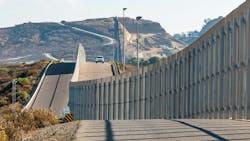The international border wall between San Diego, California and Tijuana, Mexico, is seen with an approaching U.S. Border Patrol vehicle on a nearby hill. The international border wall between San Diego, California and Tijuana, Mexico, is seen with an approaching U.S. Border Patrol vehicle on a nearby hill.