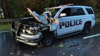 A Clayton County, GA, police officer suffered minor injuries Friday when a Tropical Storm Helene knocked over a hardwood tree, and it fell on the officer's cruiser.