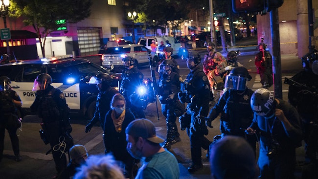 Portland, OR, police interrupt a clash between Black Lives Matter protestors and Trump supporters in August 2020.