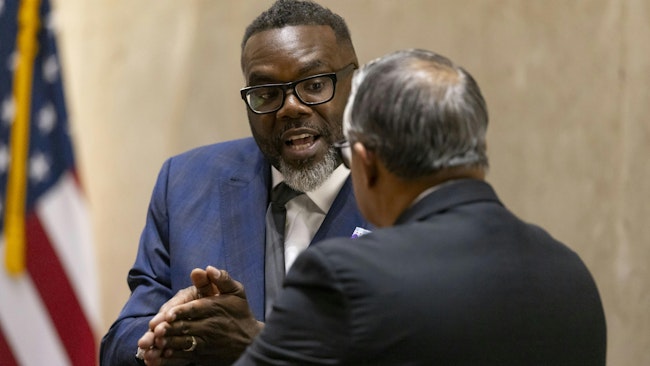 Mayor Brandon Johnson (left) and Ald. Gilbert Villegas, 36th, have a discussion after a City Council meeting at City Hall on Wednesday.