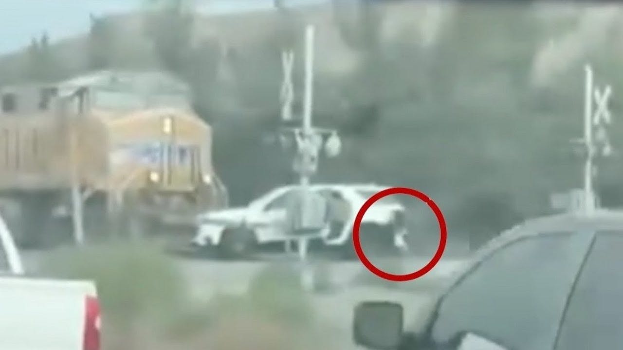 Children saved from car stuck in path of oncoming train