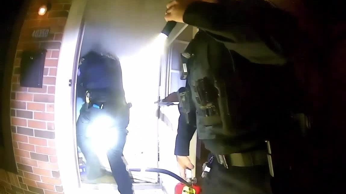 Watch Mich. Police Officers Rescue Elderly Couple from Cluttered ...