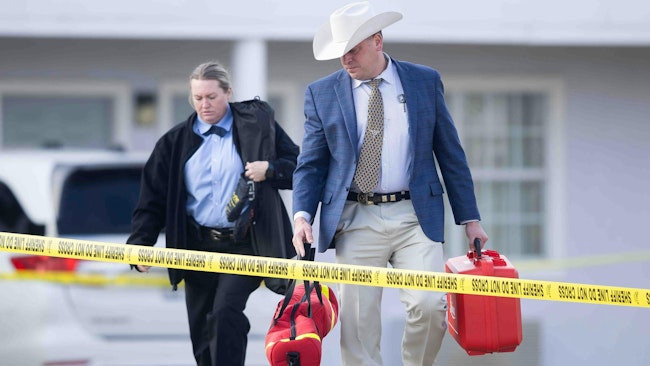 Kaufman County Sheriff investigate the scene where Terrell police officer Jacob Candanoza was shot during a struggle following a traffic stop Sunday in the parking lot of a Super 8 motel in 1600 block of South State Highway 34 in Terrell, TX on Monday, Dec. 9, 2024. Candanoza died from his wounds after being transported to Baylor Scott and White Hospital. He had been with the department since July.