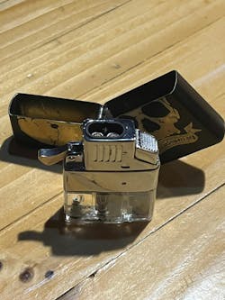 Frank's lighter, which comes in handy quite often for other than lighting cigars. Frank's lighter, which comes in handy quite often for other than lighting cigars.