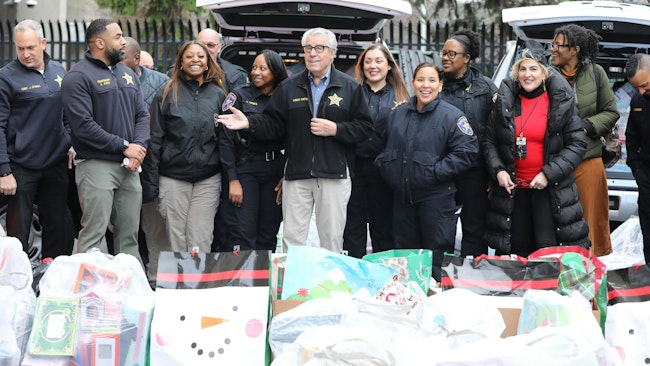 The Essex County, NJ, Sheriff's Office had a chance to help Santa Claus deliver toys and gently used coats Tuesday as part of the agency's annual gift drive. For roughly 30 years, Sheriff Armando Fontoura (center) has run the drive, with gifts distributed at schools, churches and homeless shelters. Undersheriff (and future Sheriff) Amir Jones (second from left) and other officers also worked on the drive.