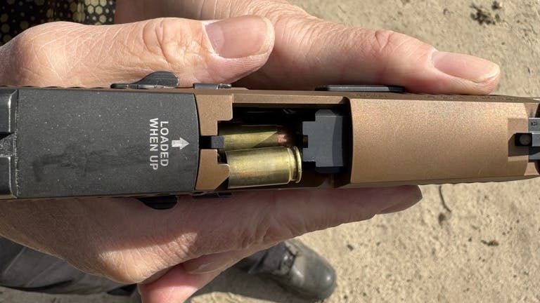 This is stovepipe a stoppage. It doesn't look like the 'perfect' stovepipe where it sticks up, perfectly centered, trapped between the slide and barrel of the gun. Sweeping this stovepipe to clear it will not clear it. Use TRT.