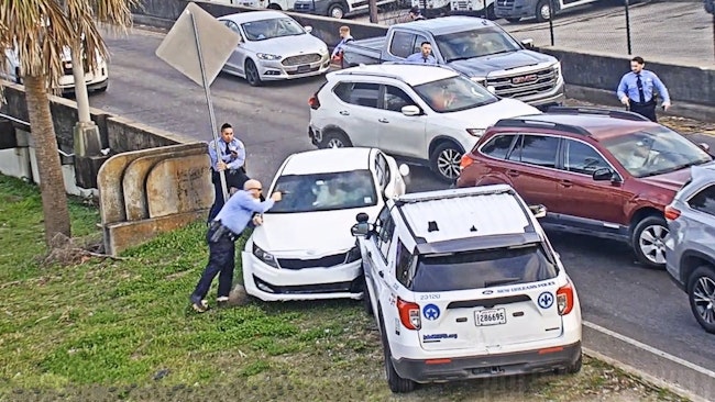 When New Orleans Confronted Suspects In A Stolen Car Stopped At A Light, The Driver Rams A Vehicle And Misses An Officer Before Knocking Another Officer Down An Embankment