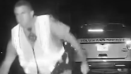 A Florida Highway Patrol trooper and a Volusia County sheriff's deputy working the scene of a deer crash on Interstate 95 early Sunday had to scramble to avoid an SUV that left the road and crashed into two vehicles before spinning back onto the interstate.