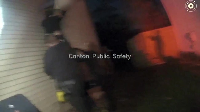 Canton Police Officers Pulled A Man With Dementia To Safety After Other Officers And Neighbors Created A Human Pyramid To Support Him As He Hung Upside Down From A Home's Second Story Window