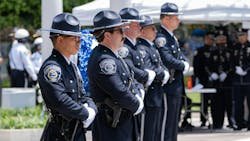 Honor guards stand during the memorial service Thursday for fallen officers at the National Law Enforcement Officers Memorial in Washington, D.C. Honor guards stand during the memorial service Thursday for fallen officers at the National Law Enforcement Officers Memorial in Washington, D.C.