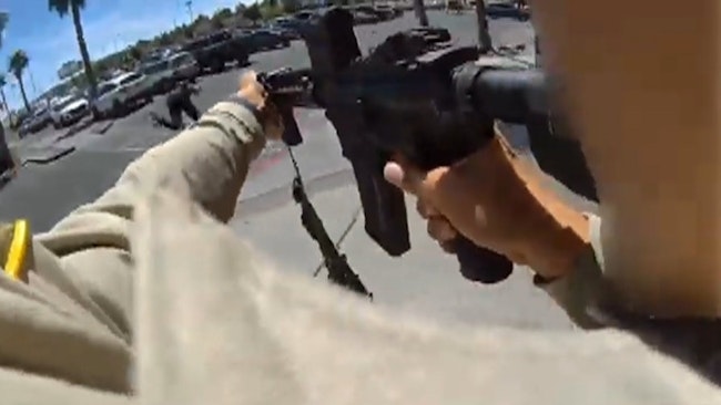 Body Camera Footage Captured Las Vegas Police Officers Confronting And Fatally Shooting A Suspect Armed With A Rifle As He Fired Dozens Of Rounds Inside An Athletic Club, Killing An Employee And Wounding Several Others