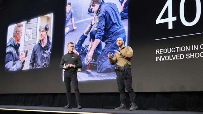 Axon Founder and CEO Rick Smith, left, is seen with Norwegian police officer, trainer and researcher Espen Dahlen-Lervåg, who highlighted his work in combatives and close quarters TASER training during the opening session of Axon Week 2025 at the Phoenix Convention Center in April.