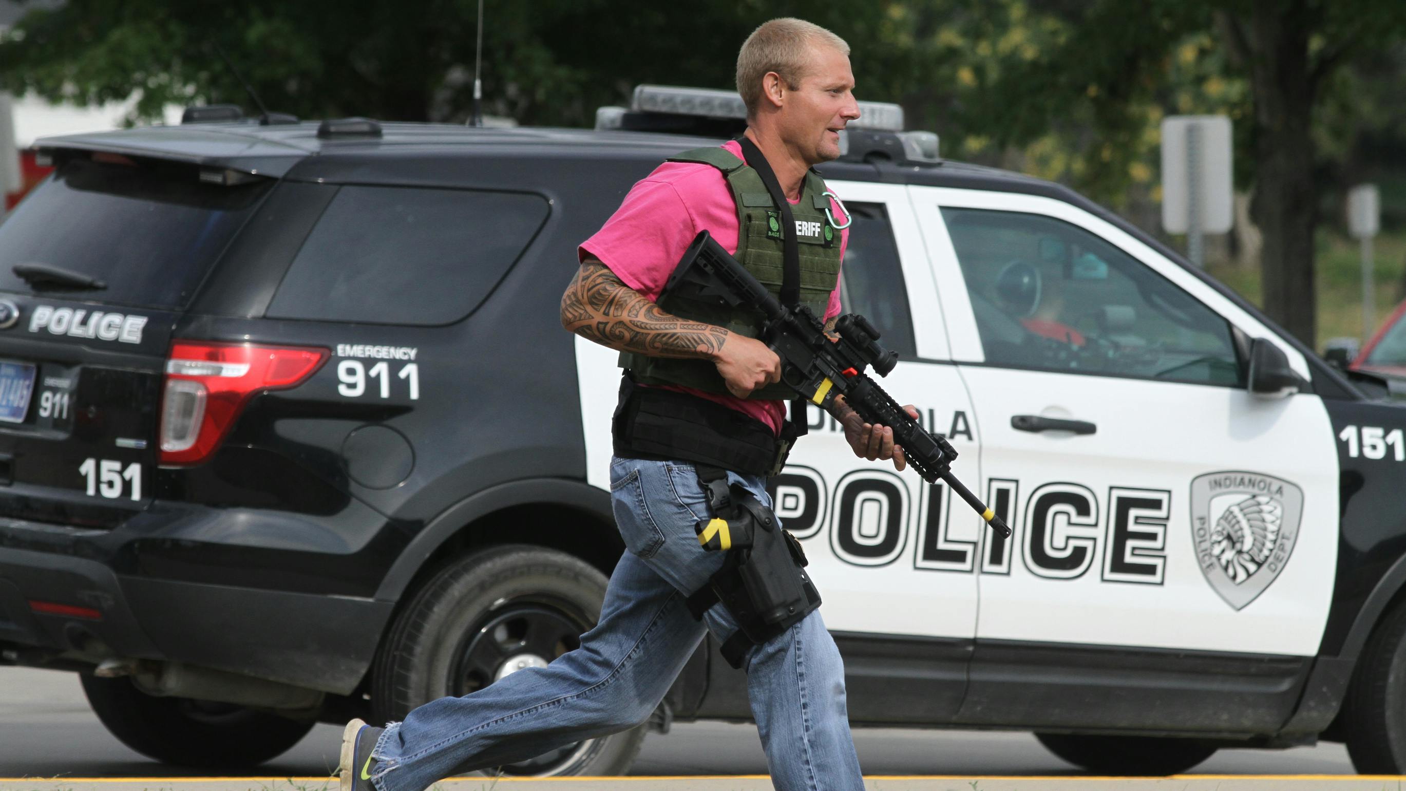 A deputy is seen carrying a rifle during an active shooter training session.