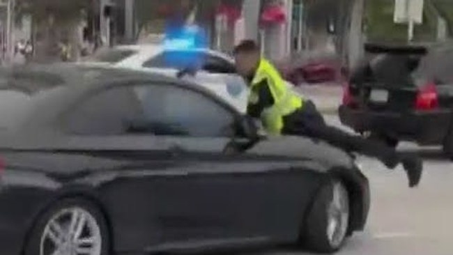 A Miami Police Officer Directing Traffic During A Caribbean Music Festival Shot And Wounded A Driver From The Hood Of A Car After He Was Struck Outside Bayfront Park