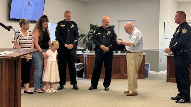 Shallotte, NC, Police Sgt. Jeremy Ferguson and Officer Christopher Brown were honored June 3 for their quick actions to resuscitate a 5-year-old girl who lost consciousness in an apartment pool June 1.