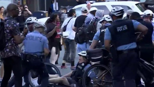 A Philadelphia Police Cruiser Was Vandalized With Spray Paint As Officers Clashed With Immigration Protesters When The 'crowd's Behavior Escalated, Becoming Violent And Extremely Disorderly