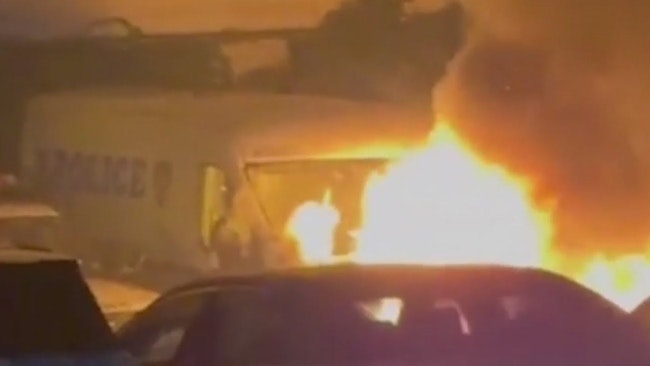 Nypd Investigators Are Searching For A Suspect Who Set Fire To Several Department Vehicles Parked In A Gated Lot In Brooklyn, Damaging Vans And Special Response Units