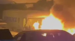 Nypd Investigators Are Searching For A Suspect Who Set Fire To Several Department Vehicles Parked In A Gated Lot In Brooklyn, Damaging Vans And Special Response Units