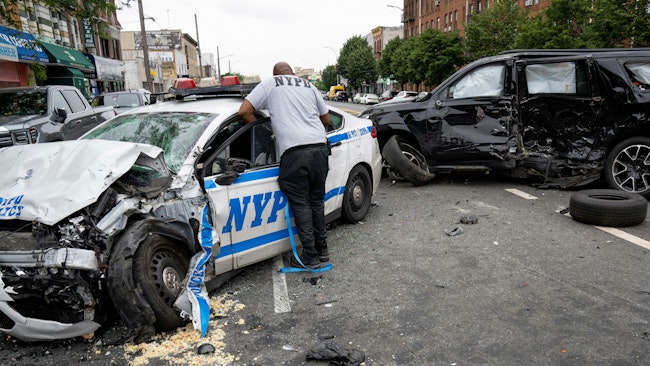 An alleged drunken driver was arrested Sunday after crashing into a Volvo SUV before slamming into a NYPD cruiser, seriously injuring two officers.