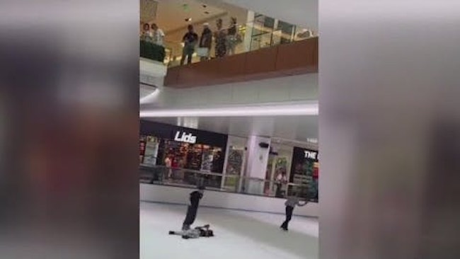 An Accused Shoplifter Suffered Multiple Injuries When He Tried To Escape Houston Police Officers By Leaping Off The Second Floor Of The Galleria Mall, Landing On The Shopping Center's Indoor Ice Rink