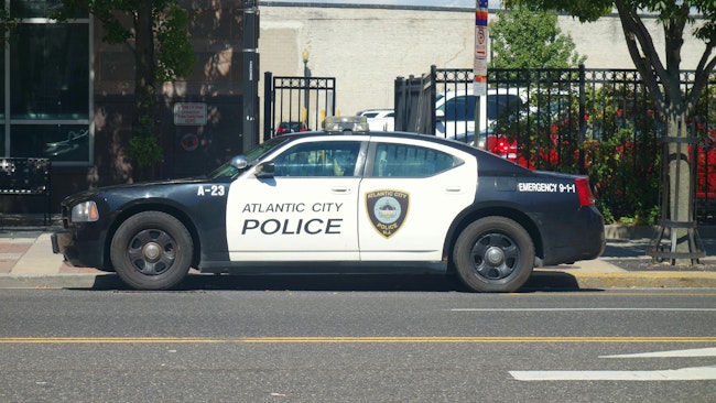 An armed suspect in a vehicle fled Atlantic City police detectives before crashing into an occupied cruiser and sending two officers to the hospital