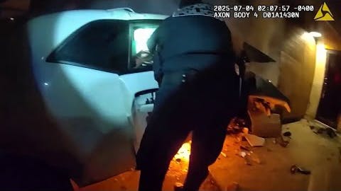 An Alleged Drag Racer Who Refused To Stop For Atlanta Police Crashed Into A Vacant Gas Station, And The Responding Officers Smashed A Window To Rescue The Passenger As A Fire Broke Out Beneath The Car