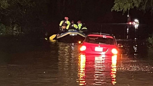 Virginia State Police troopers rescue a stranded motorist from high floodwaters in Halifax County overnight.