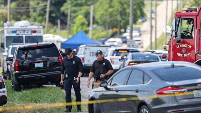 Police block off a road as they investigate a shooting at a Lexington, KY, church Sunday.