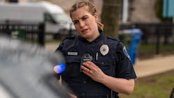 An officer is seen wearing a Motorola Solutions SVX Remote Speaker Microphone enabled with Assist. An officer is seen wearing a Motorola Solutions SVX Remote Speaker Microphone enabled with Assist.