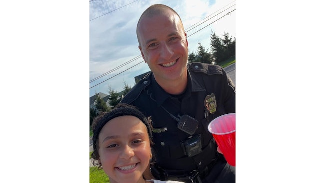 Upper Allen Township, MI, Police Officer Mark Sanguinito investigated a complaint about a neighborhood lemonade stand, and when he found no violations, he sampled a 'refreshing cup' and took a selfie with the young entrepreneur.