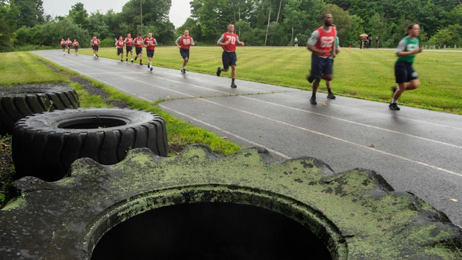 Members of the Connecticut Police Academy's Class of 387 run 1½ miles during first-day physical drills at the academy in Meriden in July.