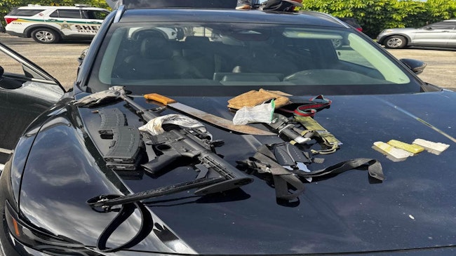 Palm Beach County, FL, sheriff's deputies arrested a man in a restricted parking lot at the Palm Beach International Airport as he was getting dressed outside a rental car with a loaded AR-15 and multiple knives inside.