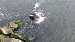 NYPD officers jumped into the East Rockaway Inlet to apprehend a suspected car thief on Aug. 5 after he tried to flee by jumping off a dock. NYPD officers jumped into the East Rockaway Inlet to apprehend a suspected car thief on Aug. 5 after he tried to flee by jumping off a dock.
