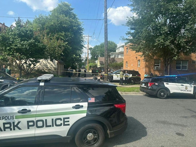 A Minneapolis park police officer was shot in the arm Tuesday when a suspect fired the officer's holstered weapon while the two were struggling on the ground.