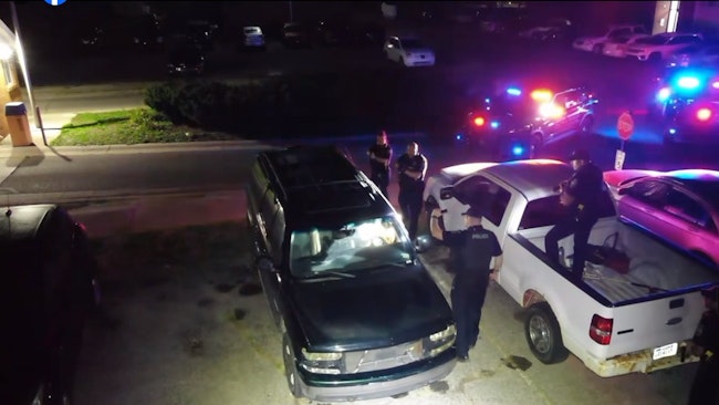 A Clinton Township, MI, police drone captured footage of officers arresting an armed man accused of setting fires inside an apartment complex Monday.