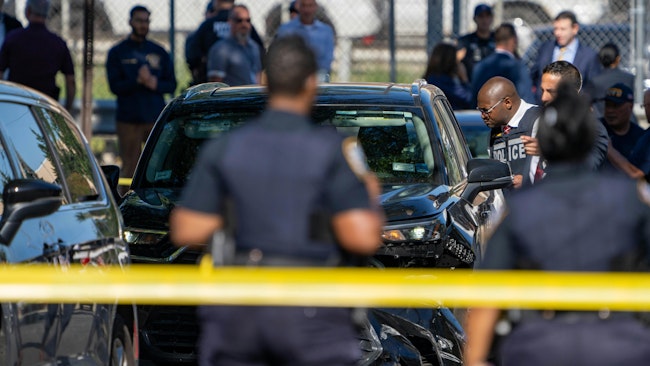 An NYPD detective was shot by another officer as he tried to stop a carjacking of an Uber driver in Queens on Friday.