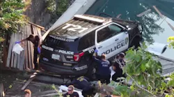 A Houston Police Officer Was Trying To Pull Over An Erratic Driver When His Cruiser Was Struck By An Suv And Sent Through A Fence Before It Was Left Dangling Over The Sun Ledge Of A Backyard Pool