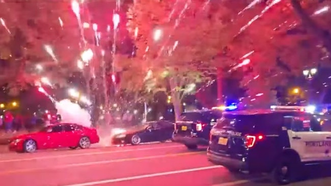 'it Was A Frightening For Officers,' Said A Portland Police Spokesperson After Crowd Members Rained Down Fireworks From A Parking Structure That Burst Near Cruisers During An Illegal Street Takeover