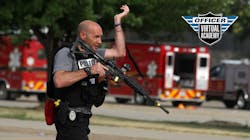 An Indianola, IA, police officer carries a rifle during an active shooter training session. An Indianola, IA, police officer carries a rifle during an active shooter training session.