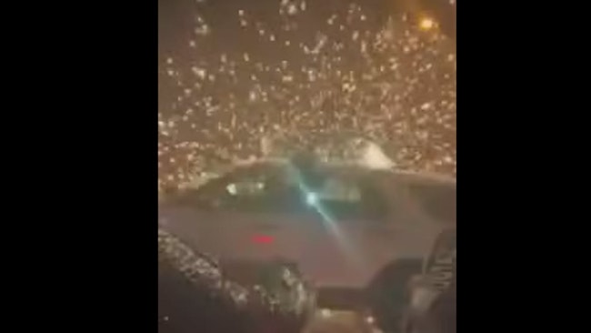 Secaucus, NJ, police cruisers were showered with fireworks early Sunday while trying to break up a street takeover of over 100 vehicles.