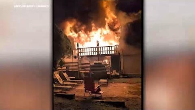Mount Vernon police officers dropped a 3-year-old girl from a second-story window and rescued four others trapped inside as flames engulfed the structure.