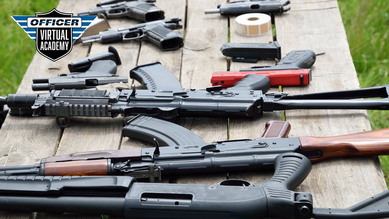 Firearms laid out on a table.
