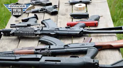 Firearms laid out on a table.