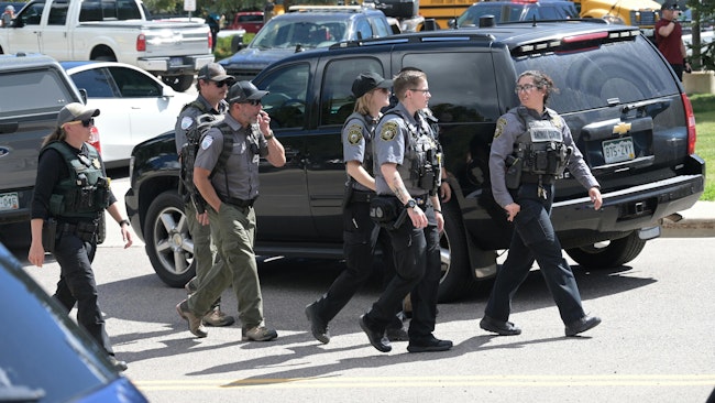 Law enforcement officers respond to a shooting Wednesday at Evergreen High School in Jefferson County, CO.