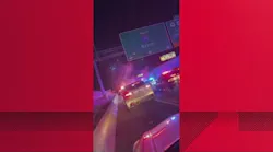 A Clayton County sheriff's deputy was pulled from his cruiser after it was pushed into guardrail and overturned in a chain reaction crash caused by a fleeing suspect.
